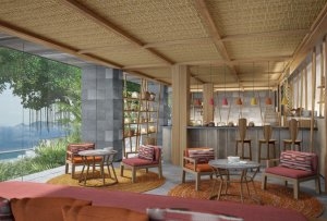 foto einer hotel lounge für eis creme und süßes im sehr modernen und designer stil mit viel licht da die eine wand aus glas besteht und einen ausblick über natur dschungel und meer gewährt noch dazu lässt die glaswand sehr viel sonne herein und die wände 